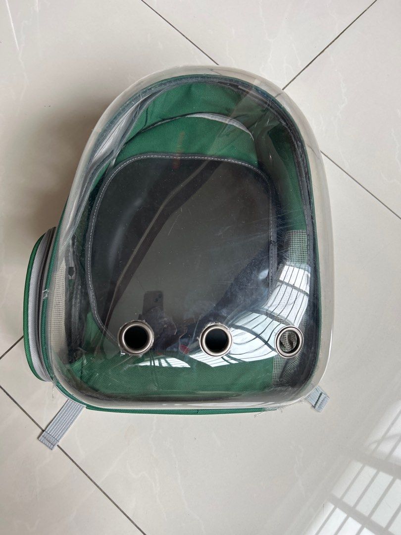 Green Bubble Pet Backpack Carrier (Category: Homes & Other Pet Accessories) located in Singapore. Submitted by happystreet2 (Listing ID 1390082589, Image 1). Description: - Excellent condition pet carrier backpack - Clear bubble window for pet viewing - Good ventilation - Adjustable straps for comfort - Mesh side pocket - Ideal for small dogs or cats Only used it once to put my pet cat in..