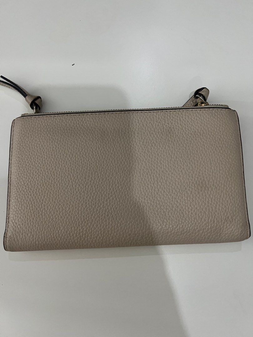 Kate Spade off white long wallet (Category: Luxury Bags & Wallets) located in Marikina City. Submitted by cjtlmood (Listing ID 1390080445, Image 2). Description: Well kept and just decluttering.