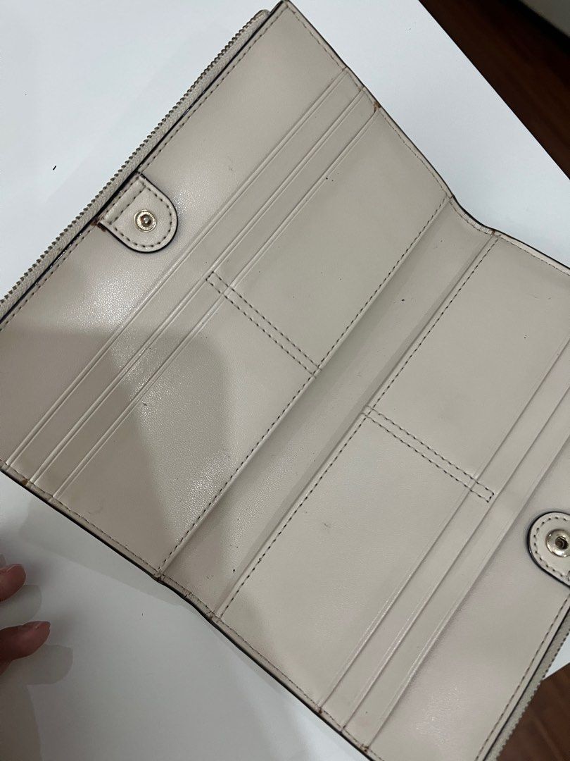 Kate Spade off white long wallet (Category: Luxury Bags & Wallets) located in Marikina City. Submitted by cjtlmood (Listing ID 1390080445, Image 3). Description: Well kept and just decluttering.