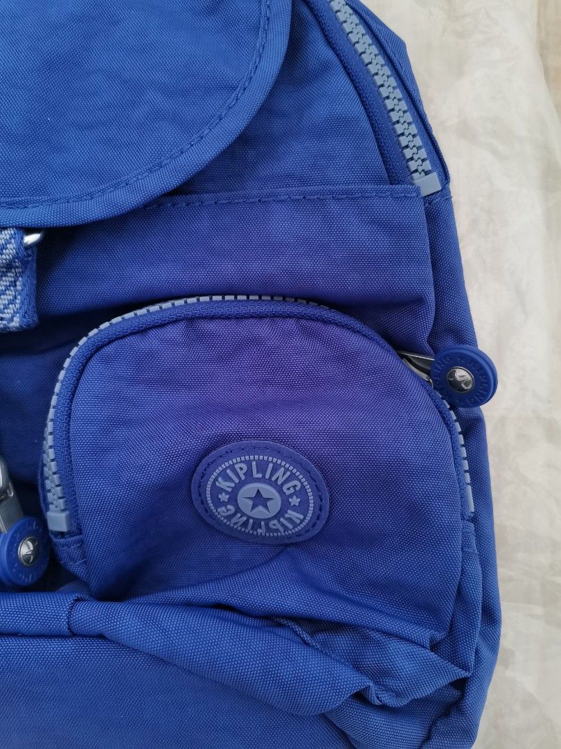 Kipling Small Backpack Bag (Category: Backpacks) located in Quezon City. Submitted by prncssgrgs (Listing ID 1390110833, Image 3). Description: Kipling Navy Mist WB Lovebug U Small Backpack 📌Details: Blue, small backpack, has many pockets/compartments to put your things in while also organized, on the go backpack 📌Brand: Kipling 📌Material: 100% Polyester 📌Brand New w/ tag; only opened for pictures *Note: Color may vary depending on the lighti