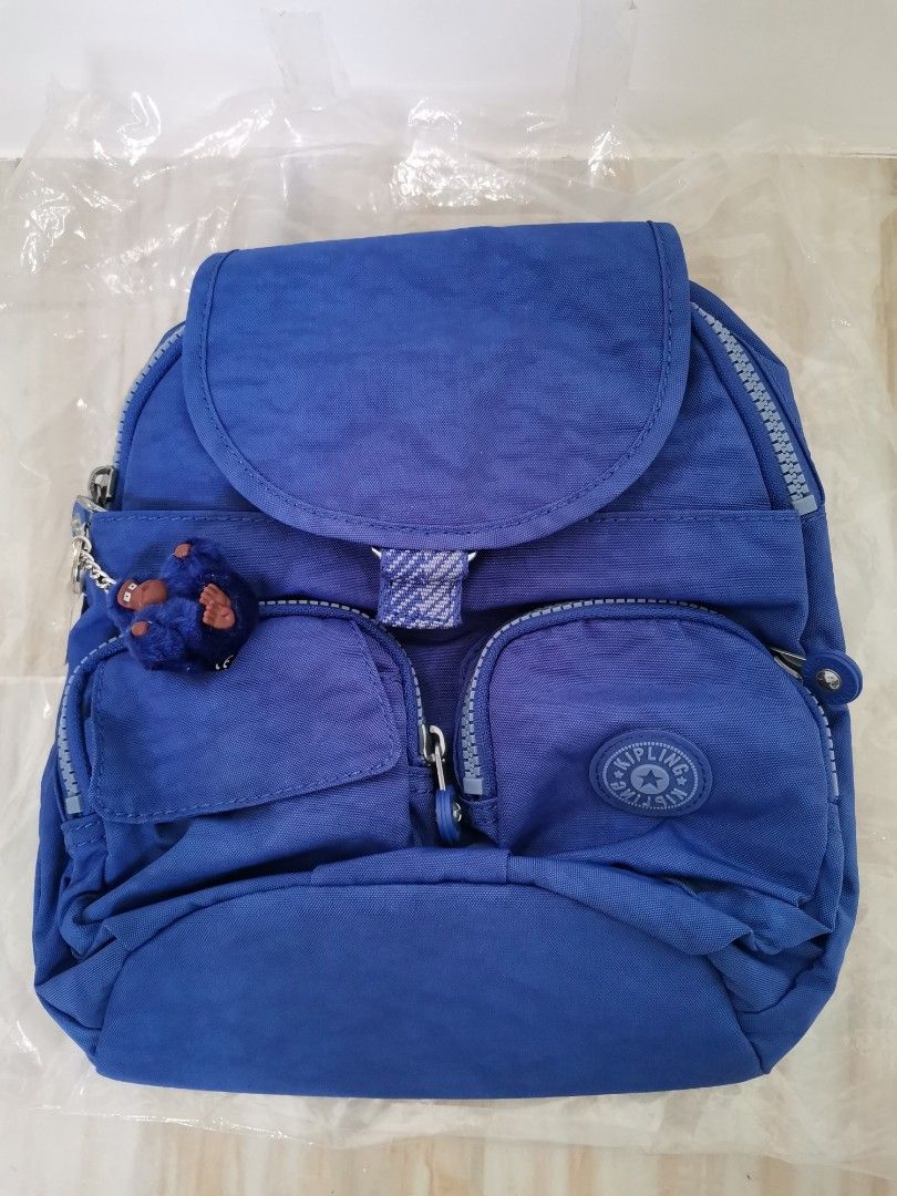 Kipling Small Backpack Bag (Category: Backpacks) located in Quezon City. Submitted by prncssgrgs (Listing ID 1390110833, Image 1). Description: Kipling Navy Mist WB Lovebug U Small Backpack 📌Details: Blue, small backpack, has many pockets/compartments to put your things in while also organized, on the go backpack 📌Brand: Kipling 📌Material: 100% Polyester 📌Brand New w/ tag; only opened for pictures *Note: Color may vary depending on the lighti