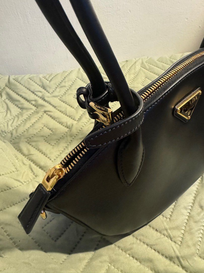 Prada Smooth Leather Black Shoulder Bag (Category: Luxury Bags & Wallets) located in Quezon City. Submitted by sayitskarla (Listing ID 1390203571, Image 2). Description: - Bought in Prada Shinsagae Main Seoul - Includes paper bag, dust bag, receipt, auth card - Smooth leather, no issues - Has built-in charm hooks or strap hooks on the side - Can send when worn upon request - MOP: BPI transfer upon meet-up .
