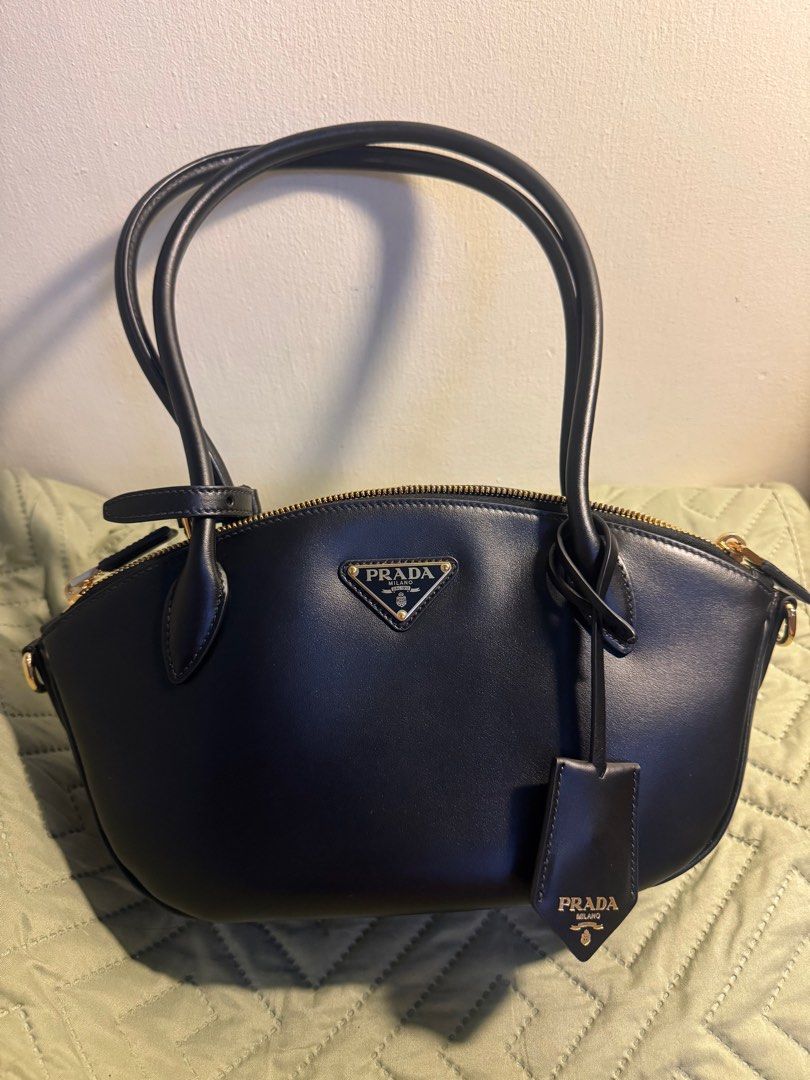 Prada Smooth Leather Black Shoulder Bag (Category: Luxury Bags & Wallets) located in Quezon City. Submitted by sayitskarla (Listing ID 1390203571, Image 1). Description: - Bought in Prada Shinsagae Main Seoul - Includes paper bag, dust bag, receipt, auth card - Smooth leather, no issues - Has built-in charm hooks or strap hooks on the side - Can send when worn upon request - MOP: BPI transfer upon meet-up .