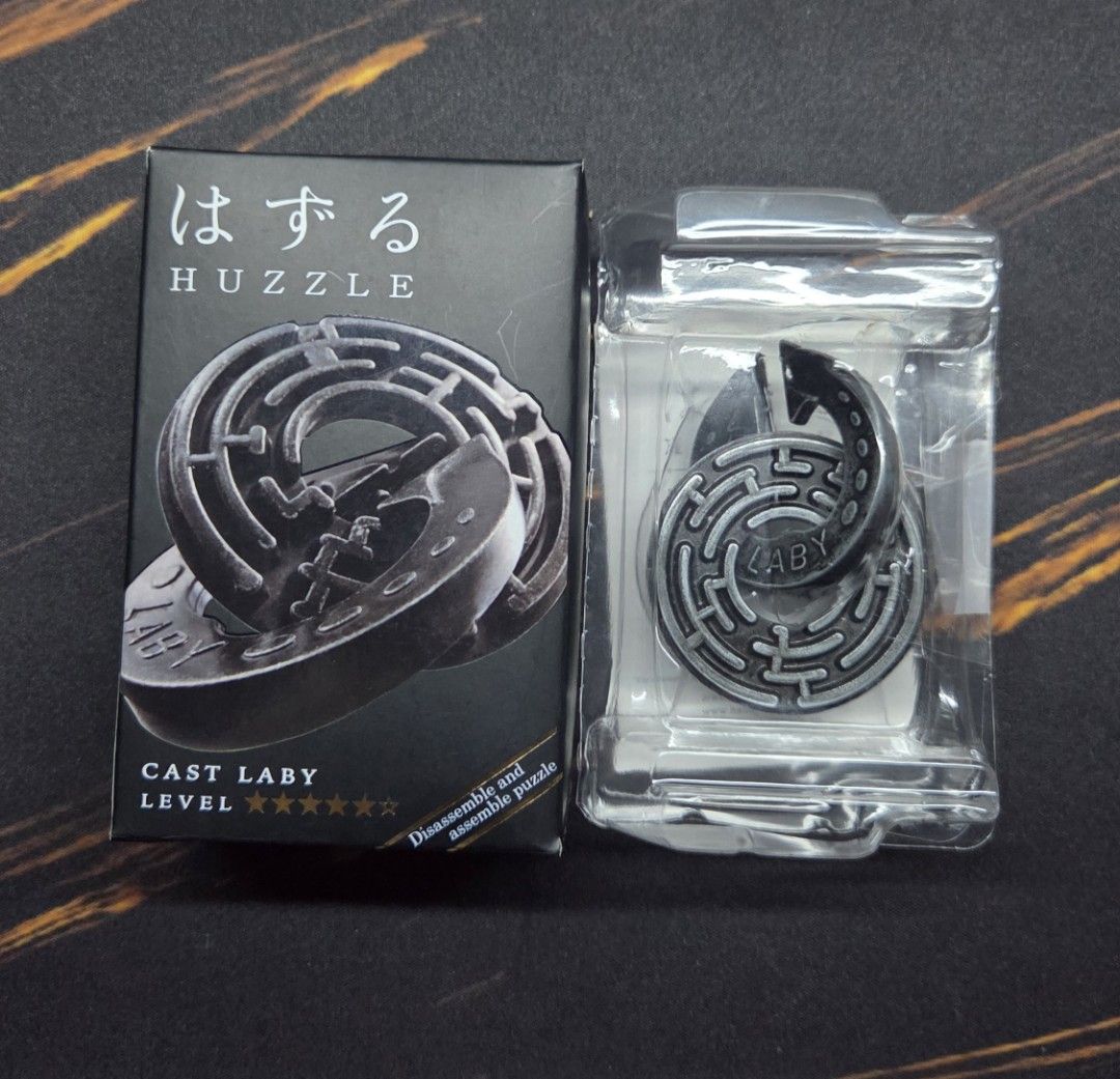Hanayama Puzzle (Cast Laby) (Category: Board Games & Puzzles) located in Cainta. Submitted by DBdibs (Listing ID 1391786144, Image 1). Description: 👀 Reading is essential. Make reading a habit. Hanayama Puzzle "Cast Laby" Level 5/6 ⭐ Authentic ⭐ Puzzle in very good condition ⭐ With box, booklet, clam shell ⭐ Was reset to start 🏠 Item will be coming from Cainta, Rizal 💰 Mode of Payment: Gcash / BDO / Union Bank 🏍️ Same day courier: Lalamove / 
