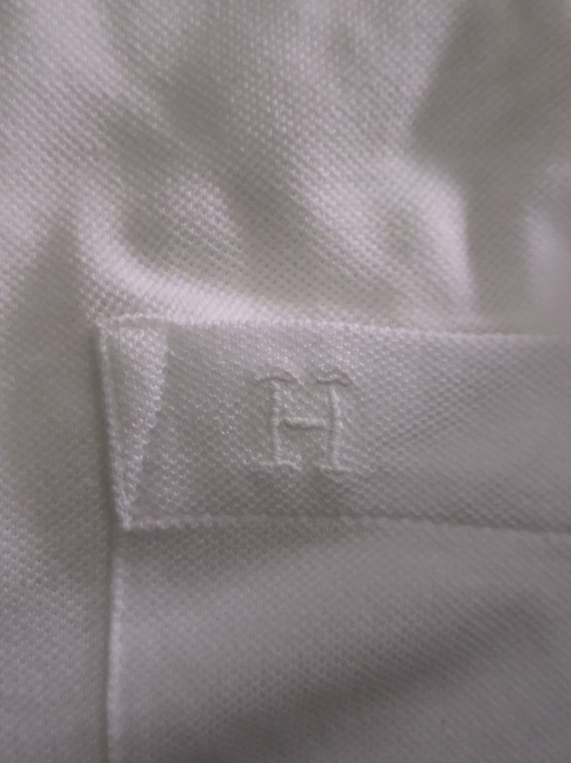 Hermes White Cotton Pocket tshirt (Category: Luxury Apparel) located in Paranaque City. Submitted by jms.preloveditem (Listing ID 1391927368, Image 2). Description: Hermes pocket tshirt Preowned. Need wash. Already removed the some lint from back. Color may differ on actual. Hermes logo reattach due to accidental event. 100 percent cotton Size L on tag. Price SRP around 27k.