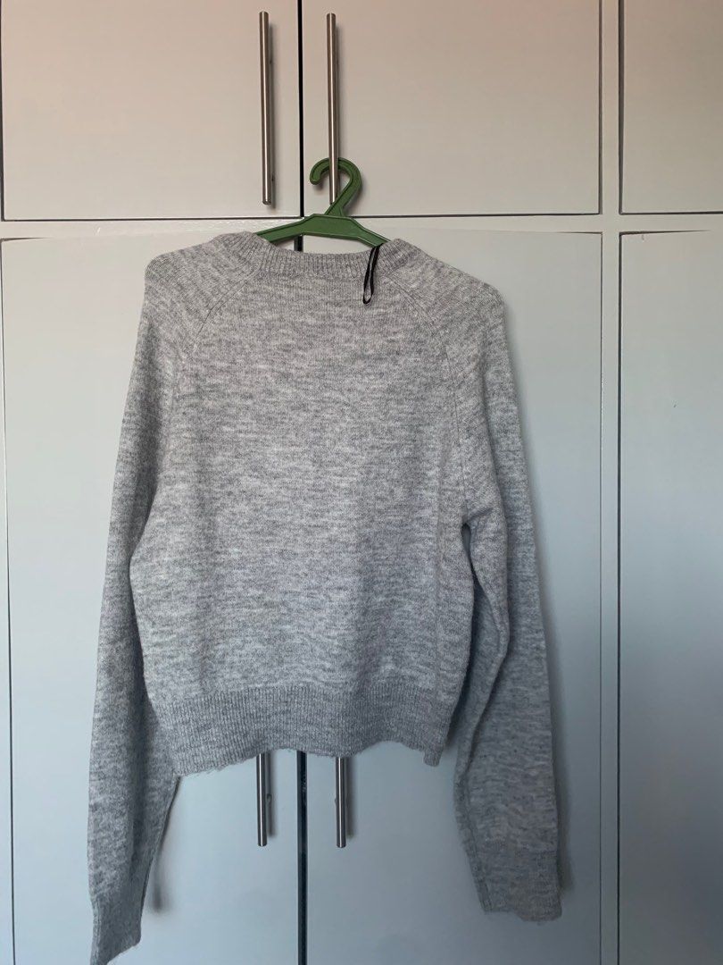 H&M Grey Knit Sweater (Category: Coats, Jackets and Outerwear) located in Biliran. Submitted by wekeepitcircular (Listing ID 1391769980, Image 1). Description: some signs of wear (see close-up photo). Letting go cheap..