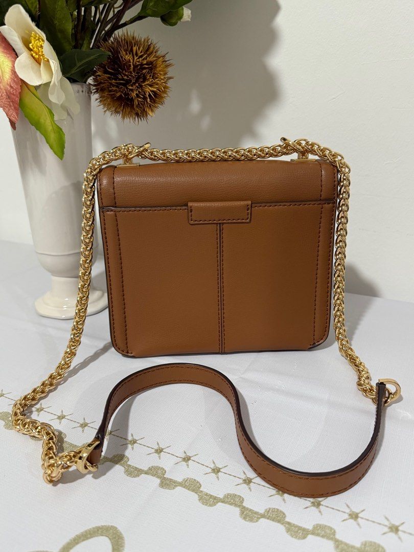 Michael Kors Sonia small shoulder/sling bag (Category: Cross-body Bags) located in San Fernando. Submitted by 3s_preloved (Listing ID 1391883427, Image 3). Description: ✅ My personal preloved from Canada ✅ with tag and care card ✅ Gold tone Hardware ✅ Can be use as shoulder bag or pwede rin sling ✅ Intact runner lining ✅ Kasya phone and smal wallet ✅ Good as new! Pwede pa panregalo. Bihira ko po to ginamit🥰 No issue! ❗️FREE SF❗️ Location🇸🇽: Sa
