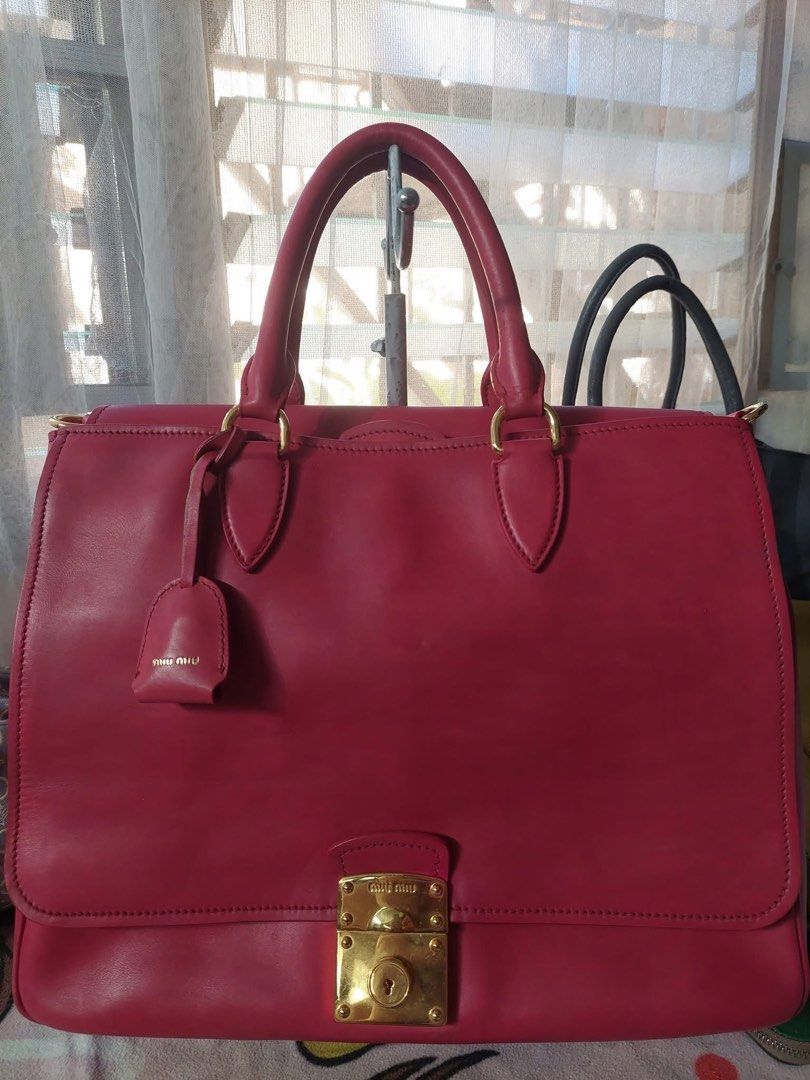 Miu Miu (Category: Luxury Bags & Wallets) located in Mercedes. Submitted by ddshoping238309 (Listing ID 1389328537, Image 1). Description: Good used condition With 3 compartment With discolorations Large size raspberry color Clochette with keys Strap Normal signs of use Hardwares still shiny with minimal scratches .