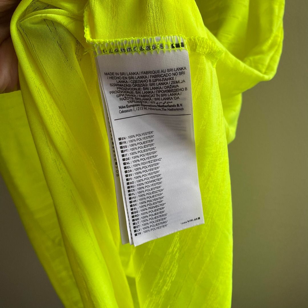 Nike Dri-Fit Top Neon Green (Category: Activewear) located in Taguig. Submitted by _artsyfab (Listing ID 1391928328, Image 3). Description: condition: 9/10 (due to faded logo in front) but overall in great condition.