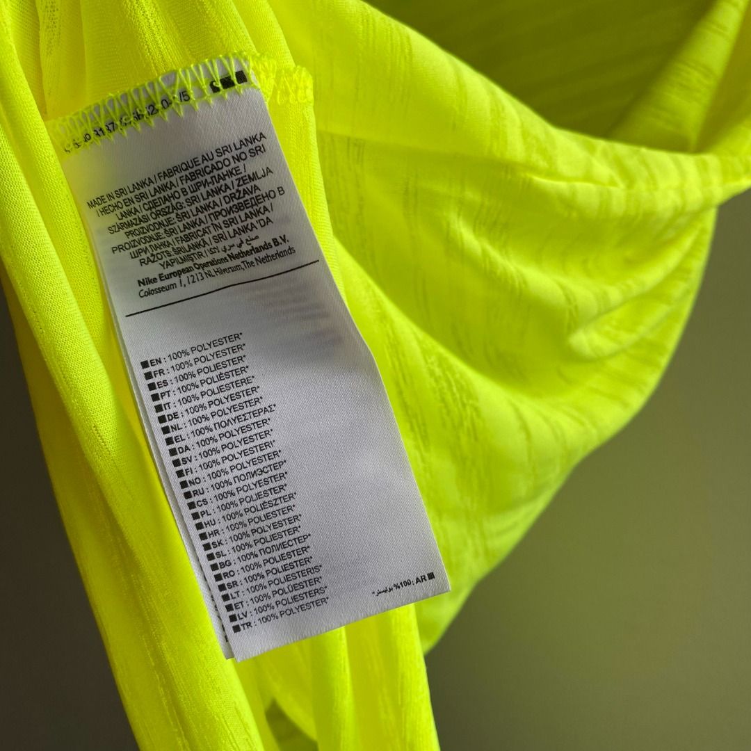 Nike Dri-Fit Top Neon Green (Category: Activewear) located in Taguig. Submitted by _artsyfab (Listing ID 1391928328, Image 2). Description: condition: 9/10 (due to faded logo in front) but overall in great condition.
