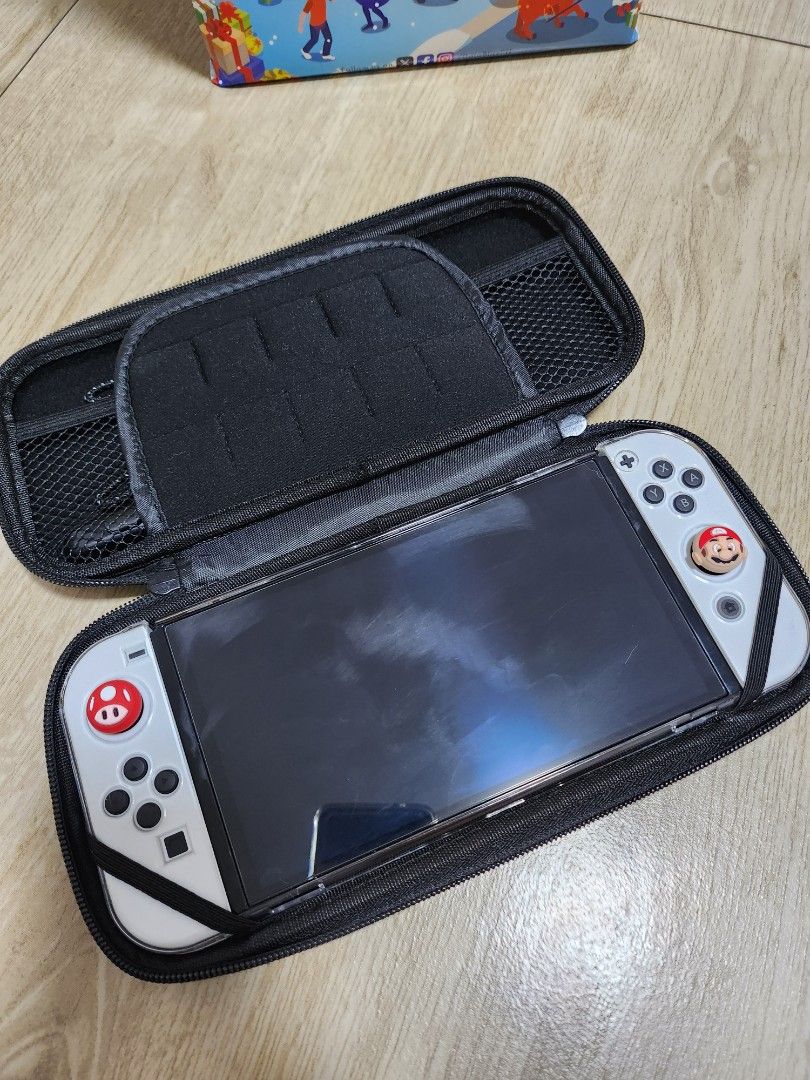 NINTENDO SWITCH OLED (Category: Nintendo) located in Mandaluyong City. Submitted by kierafrancescaa (Listing ID 1391902410, Image 2). Description: Nintendo Switch Oled Like New Condition ✅️ COMPLETE INCLUSIONS with receipt (Purchased last January 2025) ✅️ FREE OVERCOOKED 2 ✅ FREE ACCESSORIES RFS: Not using anymore, no more freetime to play ₱14,000 only! MOP: Gcash, BPI Available for Meetup!.