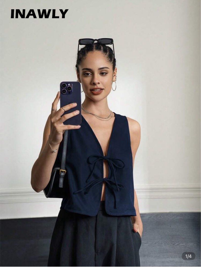 Shein Dark Blue Front Tie Sleeveless Top (Category: Sleeveless) located in Marikina City. Submitted by declutteringera (Listing ID 1391888760, Image 1). Description: - size L - fits up to 36" bust since it's loose - in excellent condition; used only once RFS: decluttering.