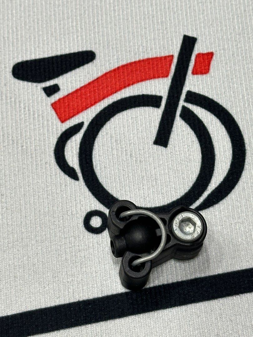 Stem Catcher (Category: Bicycles) located in Singapore. Submitted by rhiginebra (Listing ID 1391852239, Image 1). Description: - Black bike part - Features a metal loop - Includes a screw - Good condition - Exact function unknown.