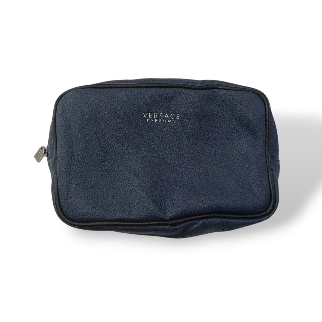 Versace Clutch Bag (Category: Luxury Bags & Wallets) located in Davao. Submitted by jecks9 (Listing ID 1391905659, Image 1). Description: leather material prestine condition 10/10 colorate paint stain see photos for details still presentable to use MAKE OFFER 📌.