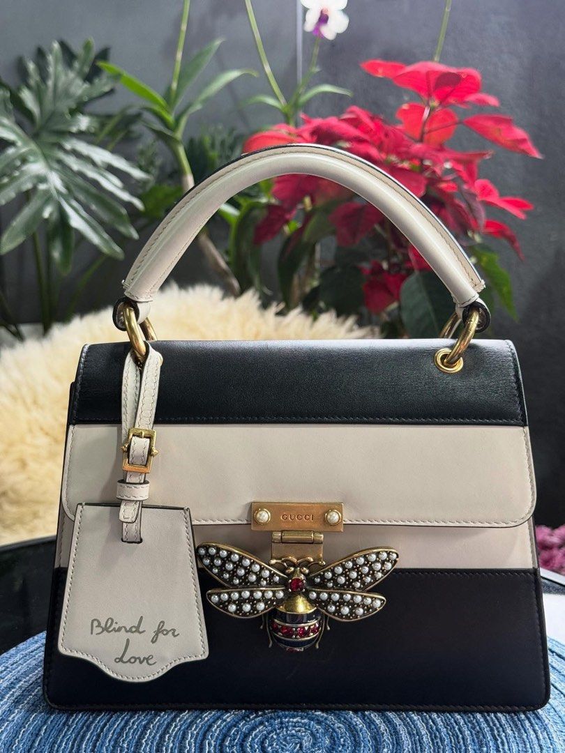 Authentic Gucci (Category: Luxury Bags & Wallets) located in Manila. Submitted by chloe_luxuries (Listing ID 1392102231, Image 1). Description: Guaranteed Original Gucci Queen Margaret medium top handle bag Still in very good condition Comes with dustbag Leather swatch strap and booklet Pm for more details.