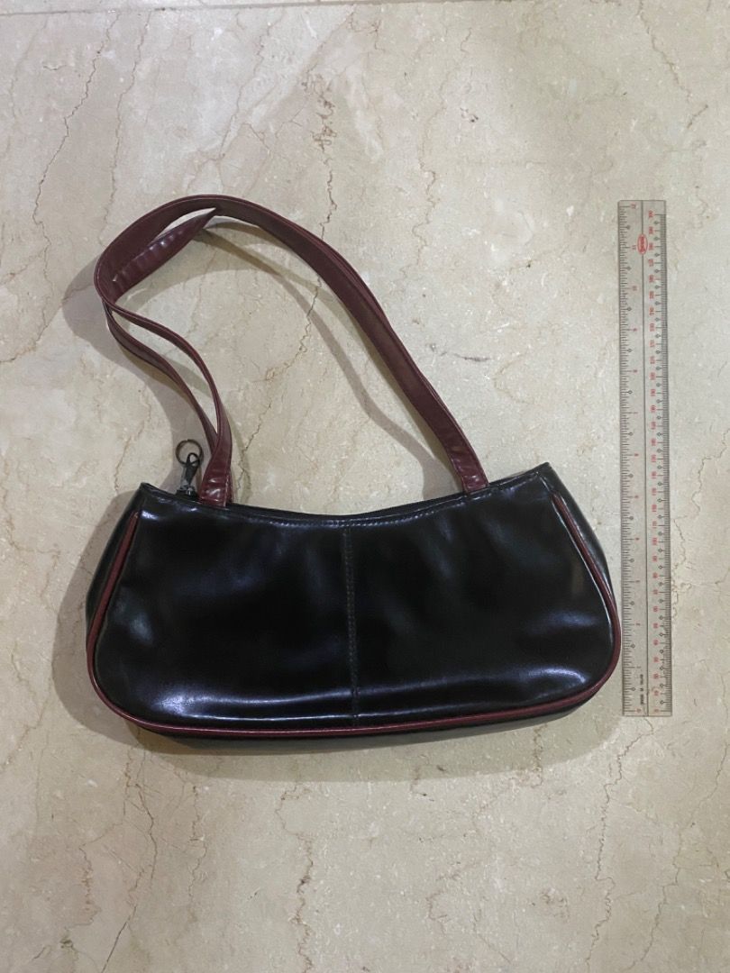 Black and Maroon Pleather Shoulder Bag (Category: Shoulder Bags) located in Makati City. Submitted by lenaloved (Listing ID 1391984660, Image 2). Description: Black and Maroon Pleather Shoulder Bag Russ by Rusty Lopez Black and maroon pleather with inner lining and zipped pocket Approx. 11.5in W x 4.5in H x 1.5in D Accessories : Shoulder Bag.