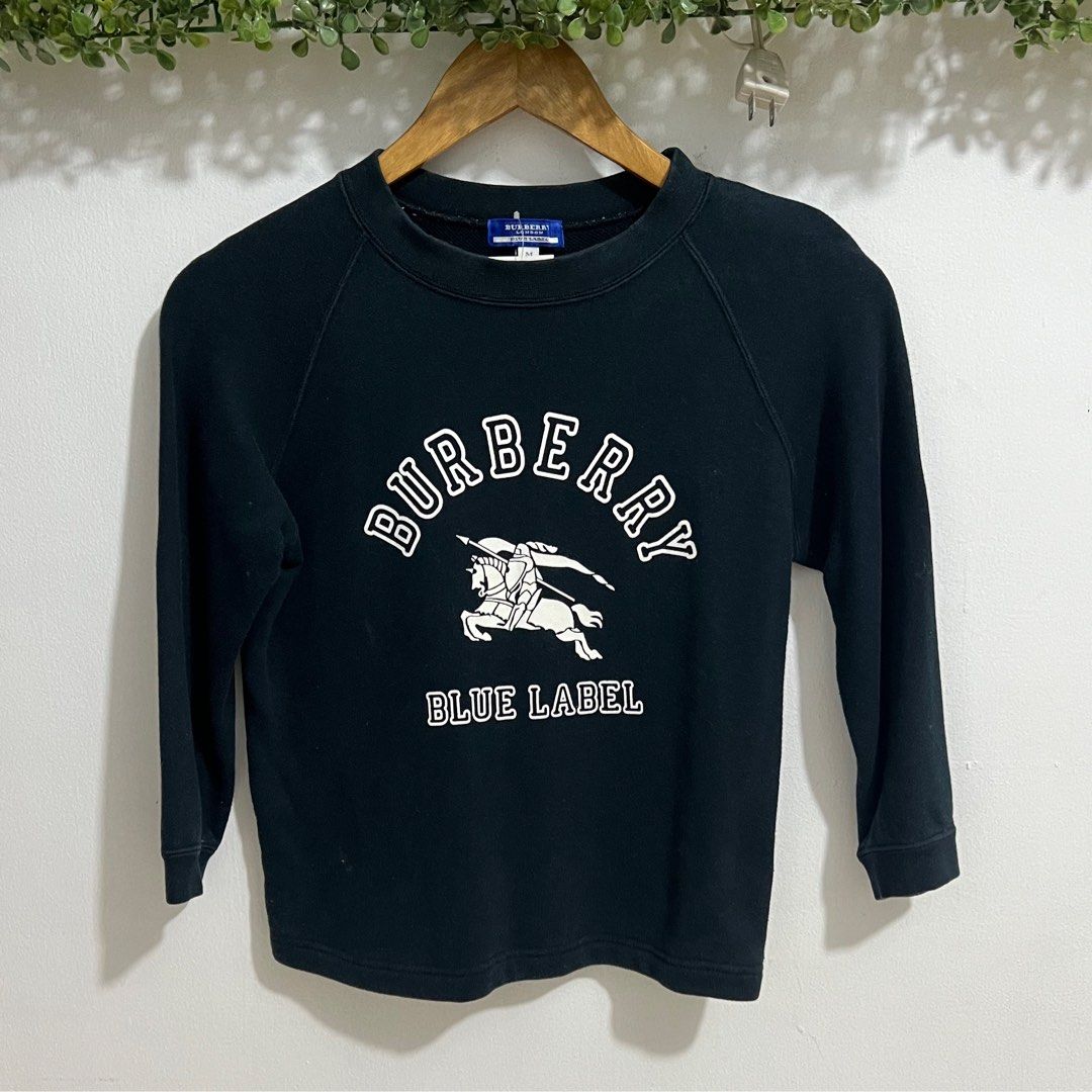 Burberry Blue Label Kids Sweatshirt (Category: Babies & Kids Fashion) located in Las Pinas. Submitted by obsessorizeph (Listing ID 1392083830, Image 1). Description: Preowned Kids Sweatshirt Brand: BURBERRY LONDON Color: Navy Blue Size: Bust 32” | Length 20.5” Location: Las Piñas City, Metro Manila Mode of Payment: GCash, BDO or BPI ₱900.