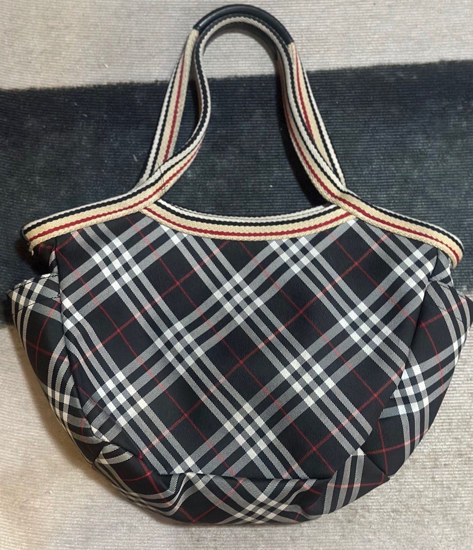Guaranteed Authentic Burberry Shoulder Bag (Category: Luxury Bags & Wallets) located in Quezon City. Submitted by donaya_luxe (Listing ID 1391980653, Image 2). Description: Original Burberry Blue Label Nova Check bag The tag inside the bag, which includes Japanese text and the company "株式会社 三陽商会" (Sanyo Shokai), indicates it is from the Burberry Blue Label line, which was a diffusion line specifically for the Japanese market. Dimension - approxim