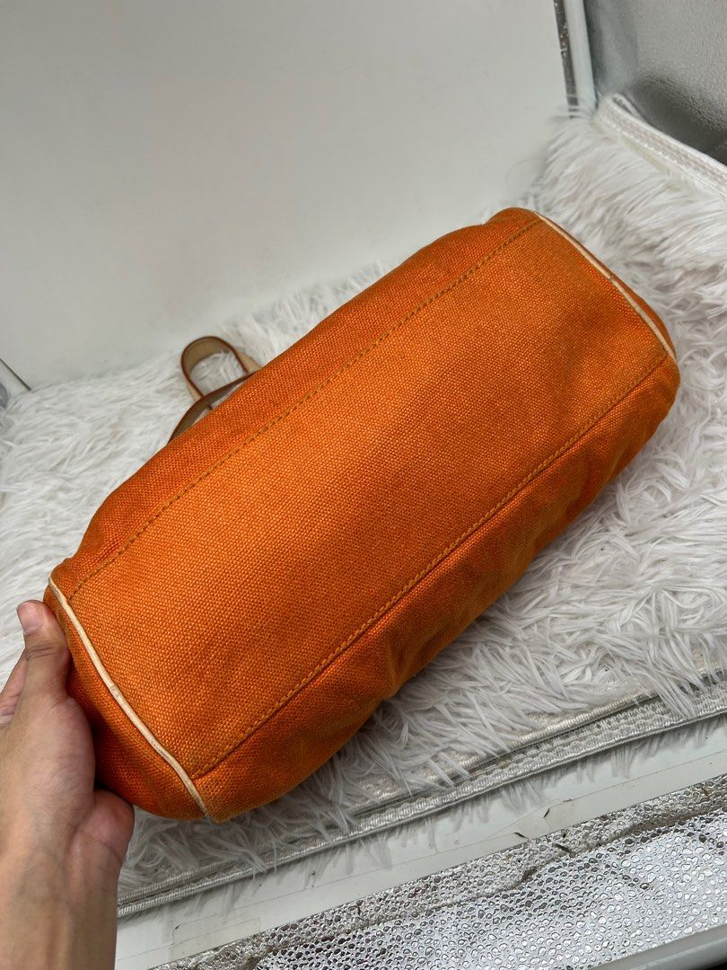 Céline Celine Orange Canvas Handbag White (Category: Luxury Bags & Wallets) located in Cavite. Submitted by aellavier (Listing ID 1392080502, Image 3). Description: minor flaw: very small dirt spot at the side. Vintage Celine. no damage preloved 2nd hand. no damage authentic original Length: 19 cm Width: 30 cm Depth: 10 cm Hand Drop: 15.
