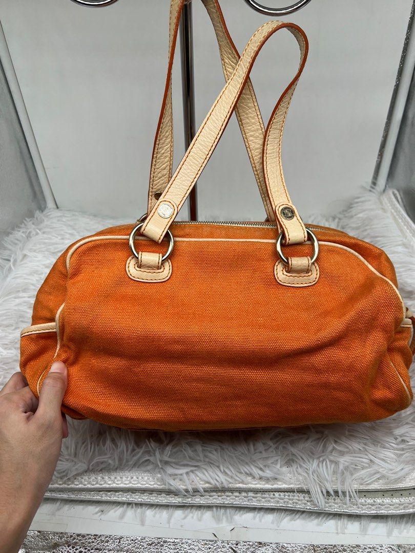 Céline Celine Orange Canvas Handbag White (Category: Luxury Bags & Wallets) located in Cavite. Submitted by aellavier (Listing ID 1392080502, Image 2). Description: minor flaw: very small dirt spot at the side. Vintage Celine. no damage preloved 2nd hand. no damage authentic original Length: 19 cm Width: 30 cm Depth: 10 cm Hand Drop: 15.