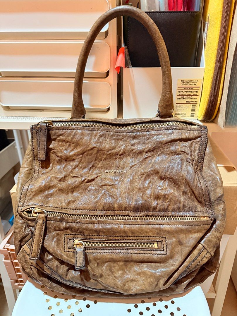 Givenchy Pandora (Category: Luxury Bags & Wallets) located in Calumpit. Submitted by sunsuncob (Listing ID 1392116523, Image 1). Description: Givenchy Pandora distressed sheepskin leather Size medium Selling for a friend (Issue) Missing letter on the brand Need retouch .