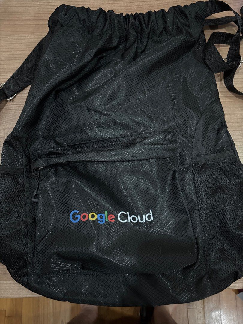 Google Cloud Drawstring Backpack (Category: Backpacks) located in Singapore. Submitted by nohacerlo (Listing ID 1392059390, Image 1). Description: - Black drawstring backpack - Google Cloud logo - Front zippered pocket - Side mesh pockets - Adjustable shoulder straps - Unused condition.