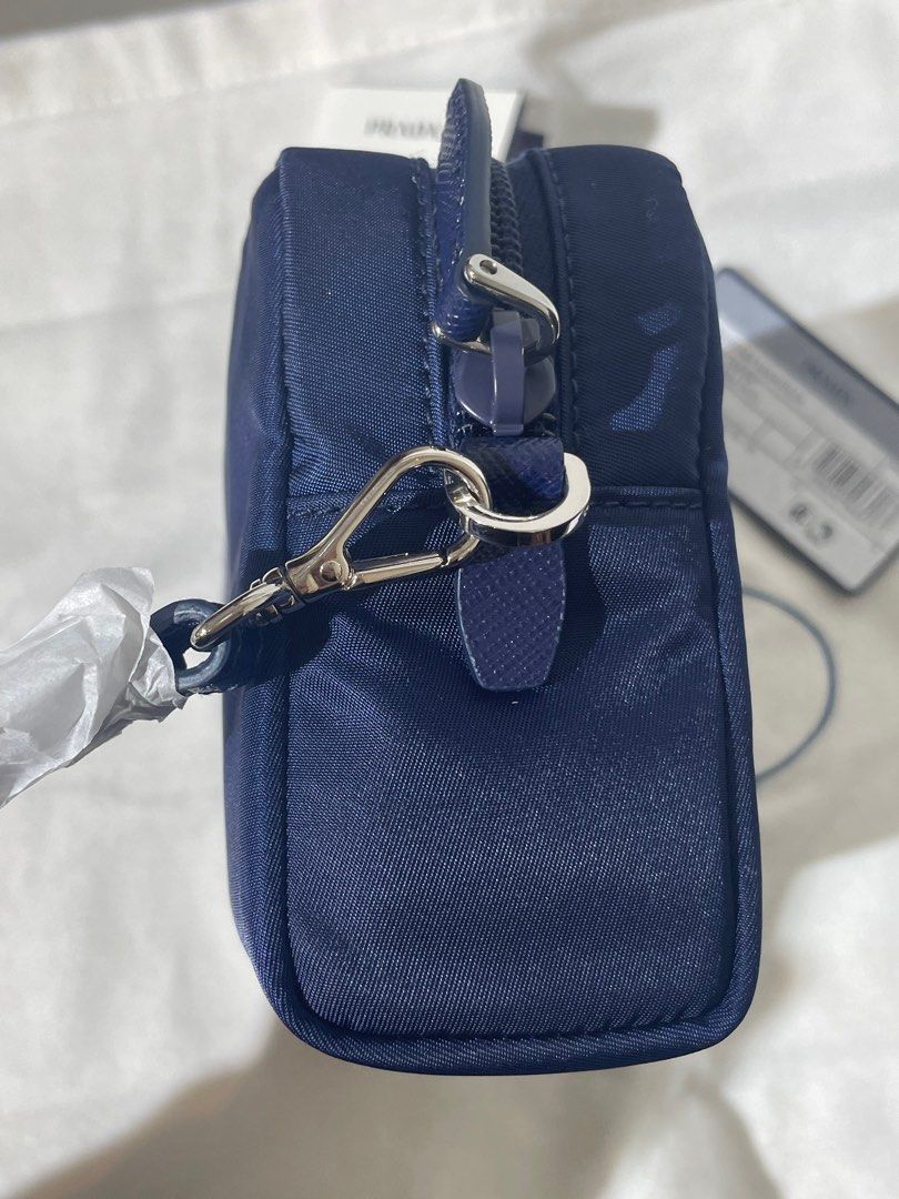 Prada pouch (Category: Bags & Wallets) located in Singapore. Submitted by firepiglet (Listing ID 1392028021, Image 2). Description: Dustbag/Carecard/Nfc ❌NO BOX❌NO RECEIPT.