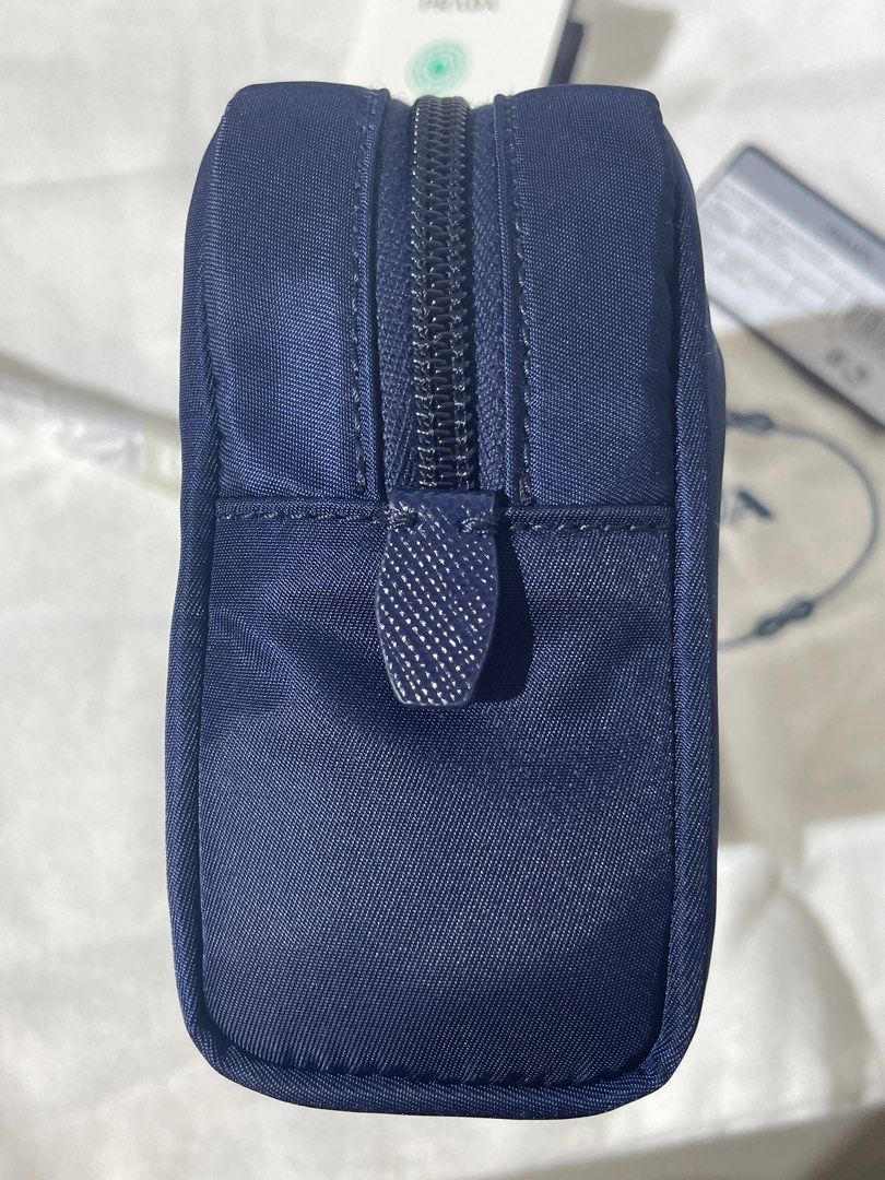 Prada pouch (Category: Bags & Wallets) located in Singapore. Submitted by firepiglet (Listing ID 1392028021, Image 3). Description: Dustbag/Carecard/Nfc ❌NO BOX❌NO RECEIPT.