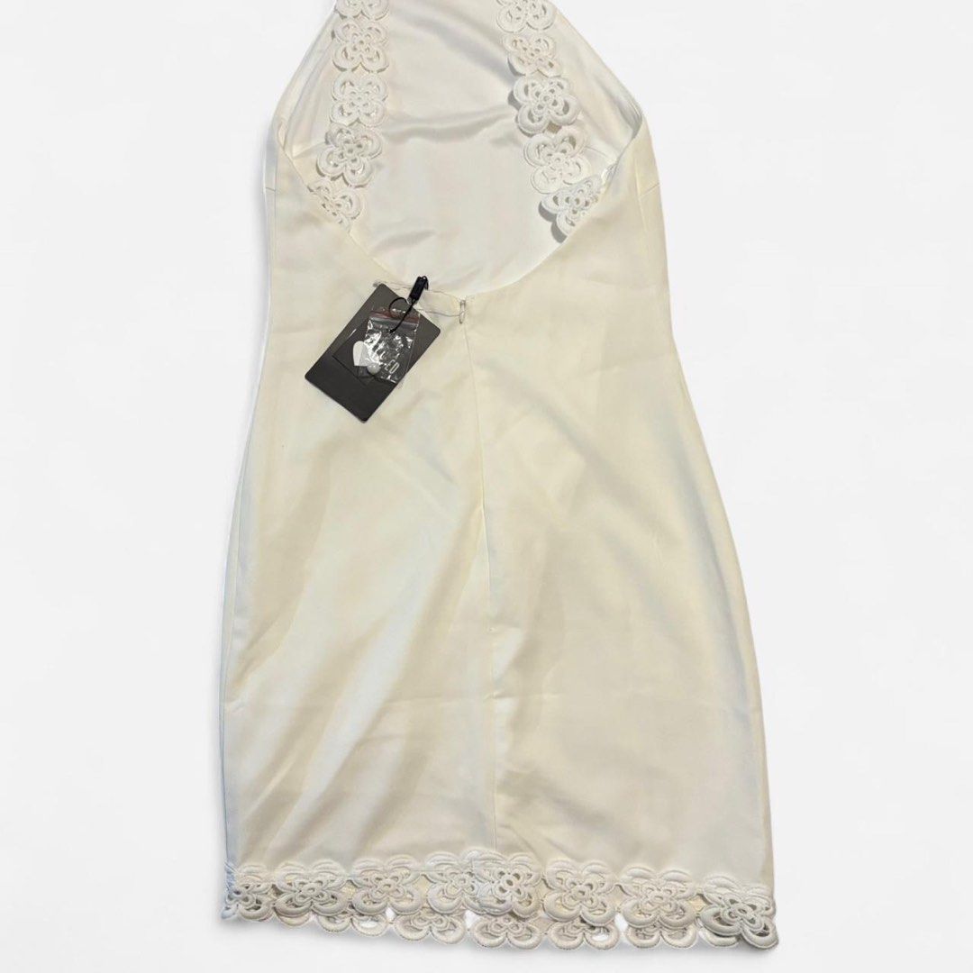 White mini halter dress w/ lace details (Category: Women's Clothes) located in Melbourne. Submitted by meroobear (Listing ID 1392093084, Image 2). Description: Missguided mini halter dress w/ lace details Size 🎀 UK 6 / EU 34 / US 2 / AUS 6 Condition 🎀 Tried on but never worn out, still has tags attached! Selling bc doesn’t really suit me white mini dress, halter neckline, lace accents, minimalist, elegant, summer style, party dress, sleeveless,