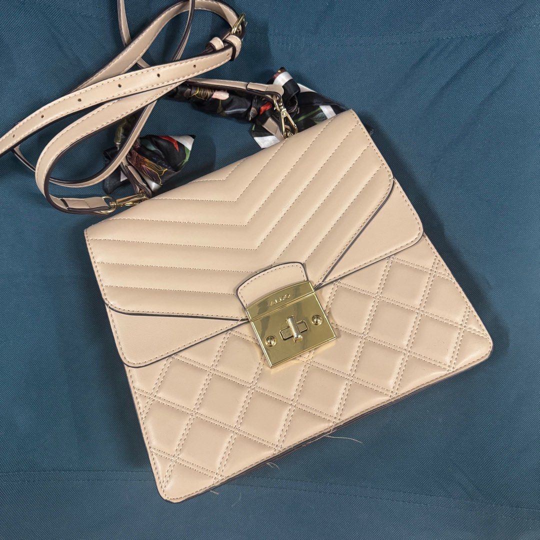 Aldo Beige Neutral Handbag Slingbag (Category: Cross-body Bags) located in Manila. Submitted by basicstuffmnl (Listing ID 1392229243, Image 1). Description: Like new. Used less than 5x only. Rfs: not using anymore. Decluttering stuff.