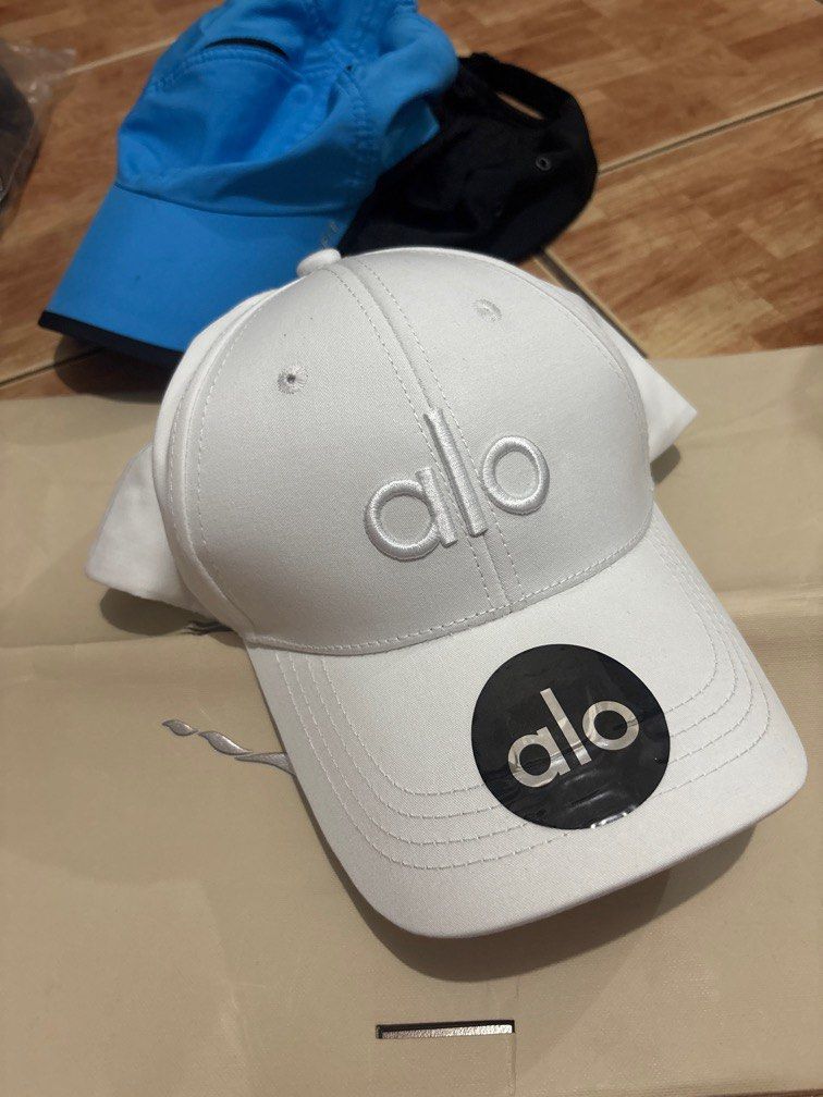 ALO WHITE HAT (Category: Caps & Hats) located in Manila. Submitted by chairsimpa29806 (Listing ID 1392263515, Image 1). Description: Alo Yoga Adjustable Strap.