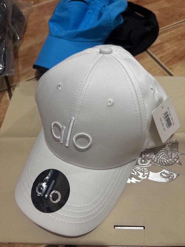 ALO WHITE HAT (Category: Caps & Hats) located in Manila. Submitted by chairsimpa29806 (Listing ID 1392263515, Image 2). Description: Alo Yoga Adjustable Strap.