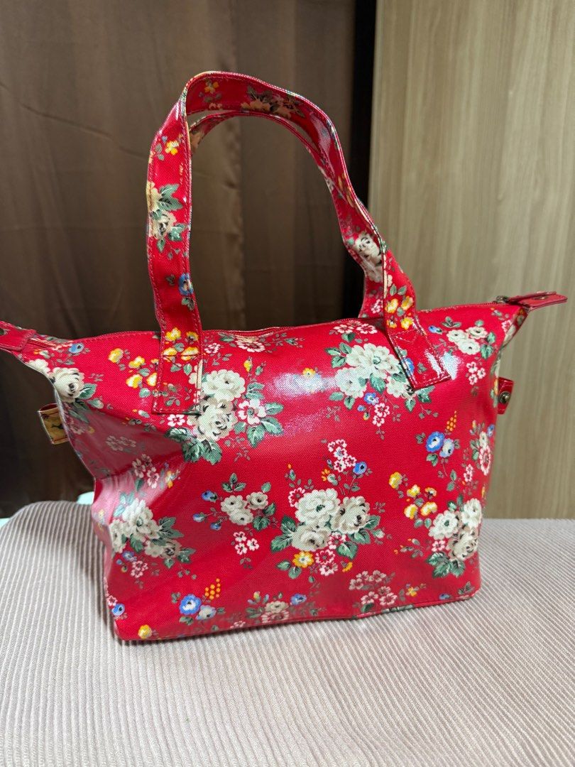 Cath Kidston Red Floral Tote Bag (Category: Tote Bags) located in Quezon City. Submitted by GreatFindsQC (Listing ID 1392276379, Image 3). Description: Authentic Cath Kidston Red Floral Tote Bag Iconic Vintage design Waterproof, PVC like material Can be used as hand or shoulder bag Well used and in very good condition No other inclusions .