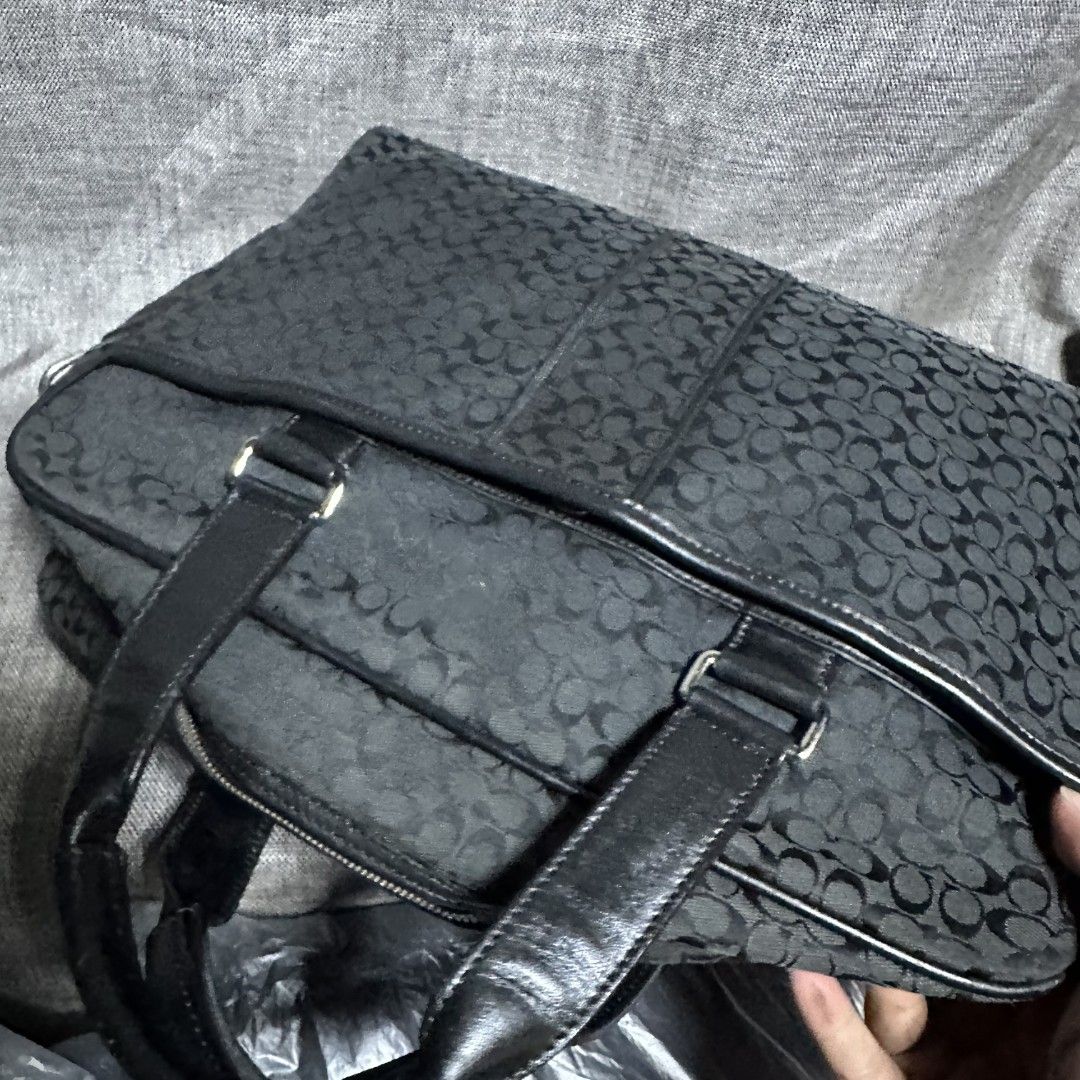 Coach hand bag (Category: Luxury Bags & Wallets) located in Manila. Submitted by greyinfash06839 (Listing ID 1392279718, Image 2). Description: 🤍Item: Coach hand bag 🤍Brand: Coach 🤍Matirial: Canvas 🤍Quality: Original 🤍color: Black 🤍Size: Large 🤍Dimension. H: 12 L: 15 W: 3 🤍Sex: For Men 🤍Issue: Sign of use 🤍Condition Rate: 9/10 🤍Other info:.