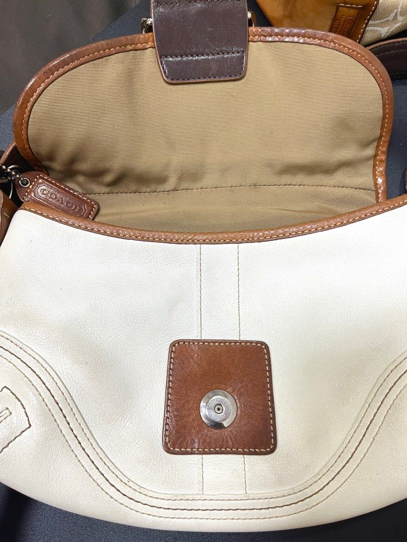 Coach Soho Mini Brown and White Flap (Category: Luxury Bags & Wallets) located in Taguig. Submitted by lakarise (Listing ID 1392296220, Image 3). Description: Body is still in good condition Signs of usage sa handle (Please see photos) Can also send videos to show overall condition .