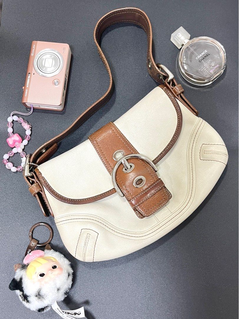 Coach Soho Mini Brown and White Flap (Category: Luxury Bags & Wallets) located in Taguig. Submitted by lakarise (Listing ID 1392296220, Image 1). Description: Body is still in good condition Signs of usage sa handle (Please see photos) Can also send videos to show overall condition .