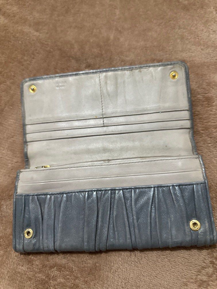 Prada long womens wallet (Category: Luxury Bags & Wallets) located in Marikina City. Submitted by purplestash28 (Listing ID 1392229655, Image 2). Description: authentic pre loved gray Prada soft leather long wallet .