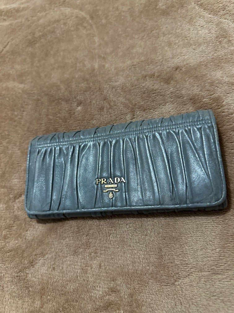 Prada long womens wallet (Category: Luxury Bags & Wallets) located in Marikina City. Submitted by purplestash28 (Listing ID 1392229655, Image 1). Description: authentic pre loved gray Prada soft leather long wallet .