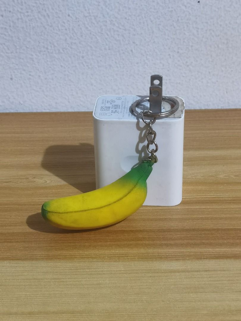 Squishy Banana Keychain (Category: Character Goods) located in Taguig. Submitted by kalabasza (Listing ID 1392300836, Image 1). Description: 📌 This is a preloved item. Please manage your expectation. 📌 Actual item posted. May small red stain. 📌 Product Color may slightly vary due to Photographic Lighting. 📌 Location: Taguig 📌 MOP: GCash. Payment first before ship. 📌 MOD: J&T, LBC, GoGo or Lalamove. 📌 DF/SF at buyer's expense. 📌 No rush sh