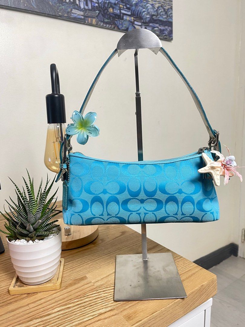 Coach Eastwest demi Sky blue (Category: Luxury Bags & Wallets) located in Cavite. Submitted by helpdeclutterthisgirl (Listing ID 1392453900, Image 1). Description: ౨ৎ Coach demi eastwest 🧚🏻‍♀️🩵 ౨ৎ - guaranteed authentic - with hangtag - needs cleaning inner - small loose thread near the zipper seam - charms are not included! - still manage your expectation since this is a vintage / preloved bags! dont expect it to be perfect!!!!!.