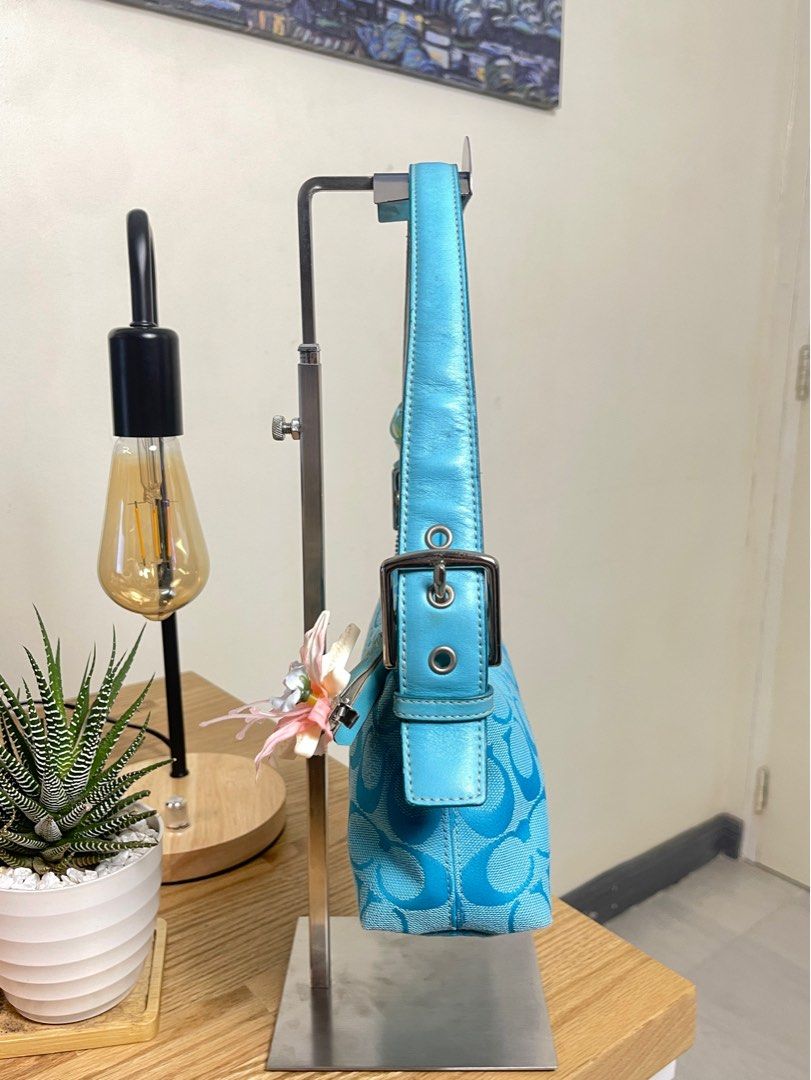 Coach Eastwest demi Sky blue (Category: Luxury Bags & Wallets) located in Cavite. Submitted by helpdeclutterthisgirl (Listing ID 1392453900, Image 3). Description: ౨ৎ Coach demi eastwest 🧚🏻‍♀️🩵 ౨ৎ - guaranteed authentic - with hangtag - needs cleaning inner - small loose thread near the zipper seam - charms are not included! - still manage your expectation since this is a vintage / preloved bags! dont expect it to be perfect!!!!!.