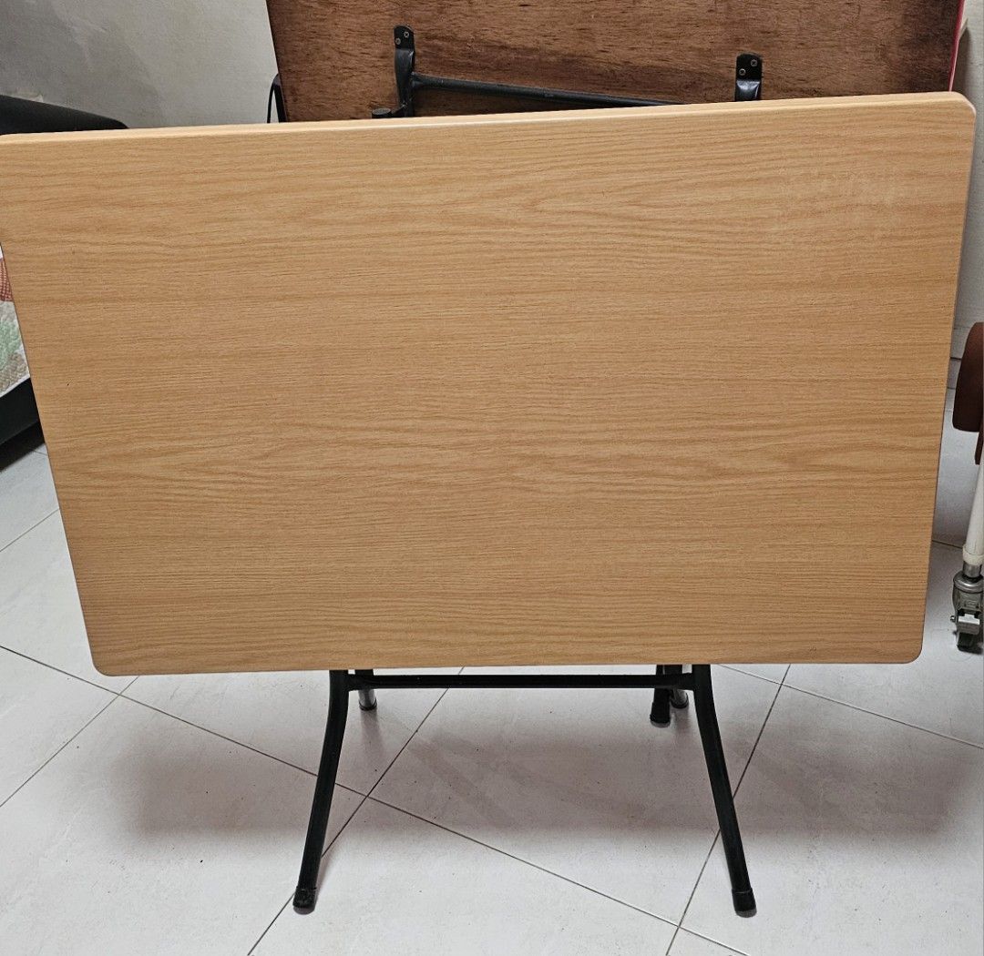 Foldable Table (Category: Tables & Sets) located in Singapore. Submitted by cathylst (Listing ID 1392335192, Image 2). Description: - 35inches x 24 inches - Foldable table - Beige tabletop - Black metal frame - Great for small spaces - Easy storage - Fully functional - Shows some wear and tear.