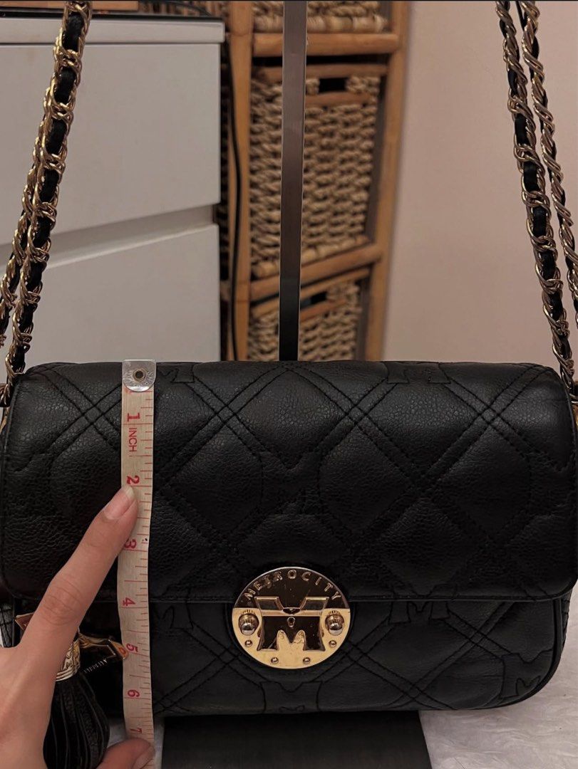Metrocity Bag (Category: Shoulder Bags) located in Bulacan. Submitted by rds.declutter (Listing ID 1392458884, Image 3). Description: Small size|Convertible Color Black Genuine Leather Push lock closure Gold hardwares|with signs of use with Original Keychain Original Strap|detachable Hologram Interior|Clean Minimal signs of use.