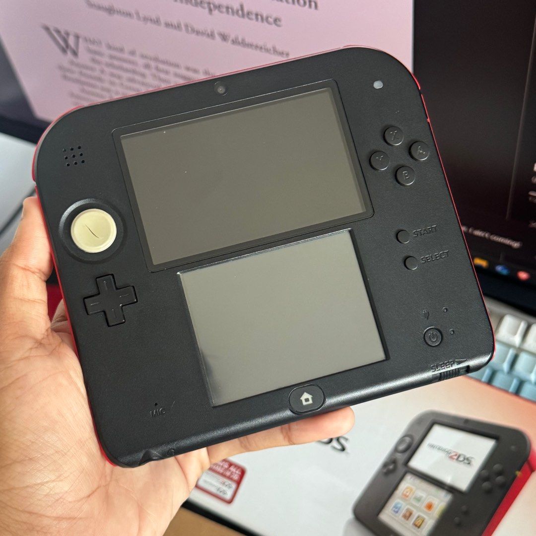 Nintendo 2DS Black/Red (Category: Nintendo) located in Quezon City. Submitted by consoleciety (Listing ID 1392401489, Image 2). Description: Selling Nintendo 2DS Black/Red boxed 4GB ₱8,500 —Very good condition. Minimal scratches only on the back and 1-2 dust on screen (not dead pixels). Joystick rubber has a slice in the middle. —Non-CFW/JB/modded —Inclusions shown on photos & 4GB SD +600 for 64GB SD (w/ cfw and games installation) 1. meet-up at 