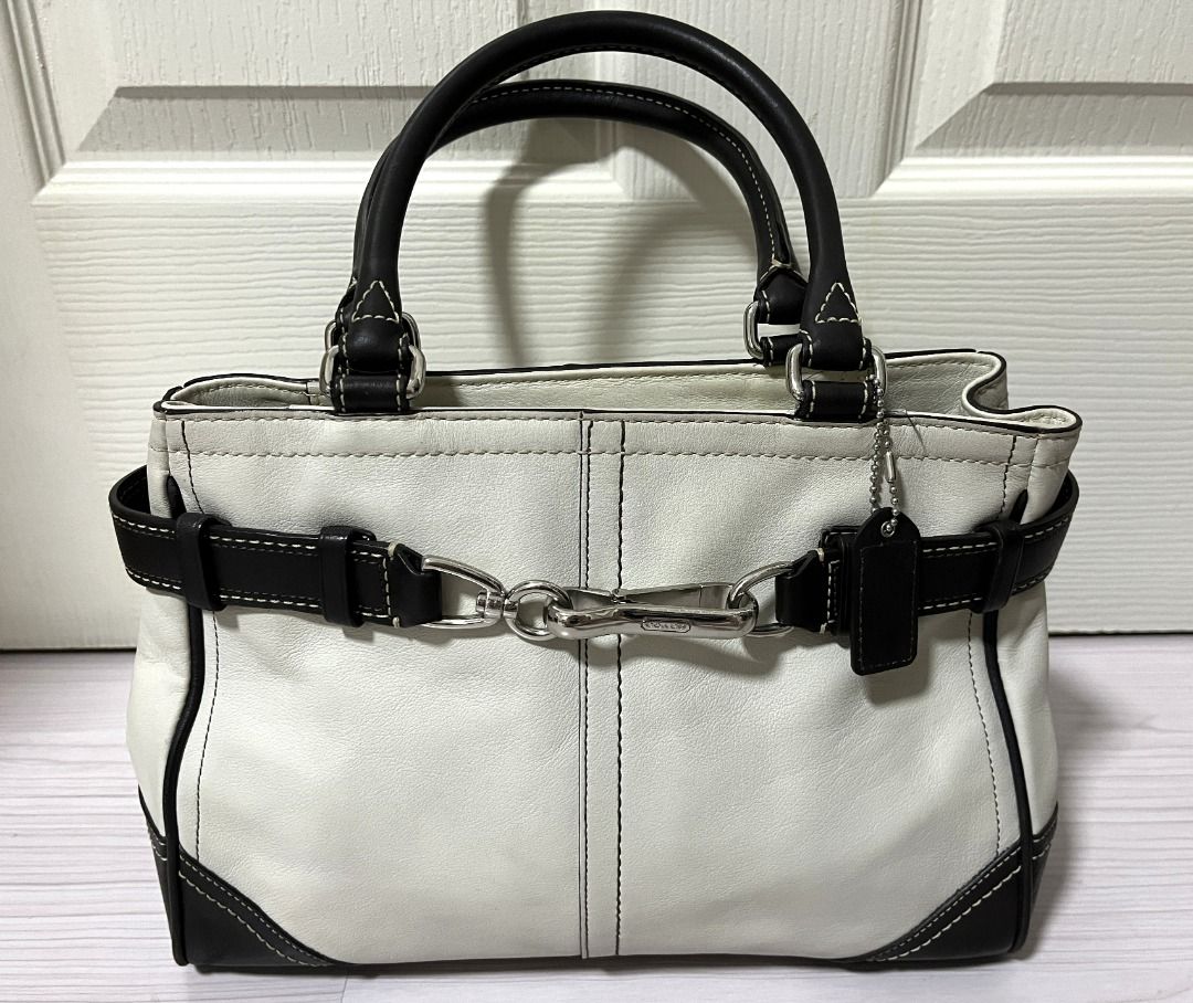 [Pre-Loved] Coach Leather Handbag Purse (Category: Luxury Bags & Wallets) located in Pasig City. Submitted by findingviolet (Listing ID 1392427438, Image 1). Description: [Pre-Loved] Coach Leather Handbag Purse - Original Style: Handbag / Purse Color: Ivory with dark brown accents Material: Leather Condition: Used with care - actual photos posted, some scratches on the silver buckle RFS: Decluttering Mode of Payment: GCash / Maya / BPI Bank Trans