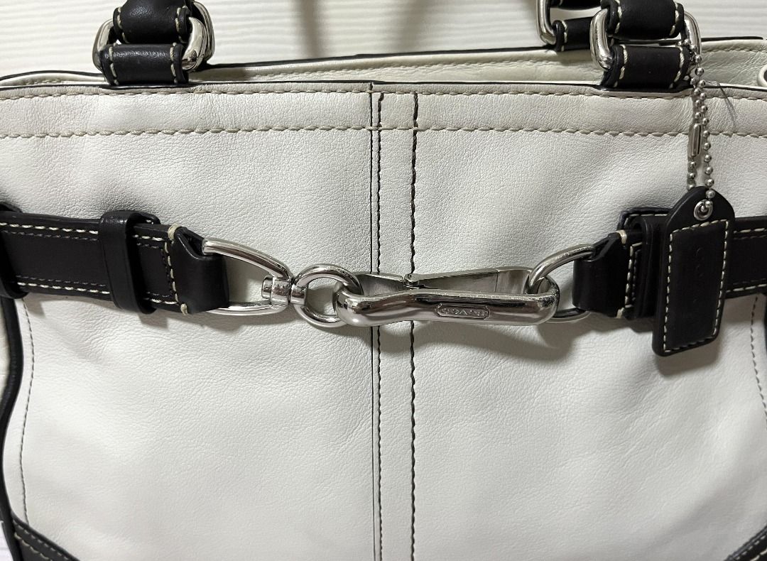 [Pre-Loved] Coach Leather Handbag Purse (Category: Luxury Bags & Wallets) located in Pasig City. Submitted by findingviolet (Listing ID 1392427438, Image 2). Description: [Pre-Loved] Coach Leather Handbag Purse - Original Style: Handbag / Purse Color: Ivory with dark brown accents Material: Leather Condition: Used with care - actual photos posted, some scratches on the silver buckle RFS: Decluttering Mode of Payment: GCash / Maya / BPI Bank Trans