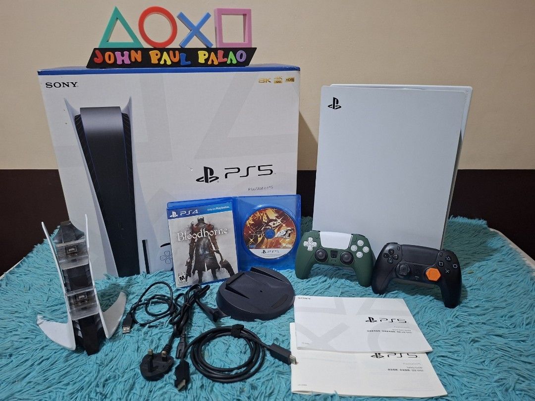 PS5 latest cfi model (Category: PlayStation) located in Manila. Submitted by pjthebartender (Listing ID 1392342533, Image 1). Description: PS5 latest cfi model no history of repair 2 controller Complte w/box n manual Orig hdmi Orig charging cable 2 phyical game Plus 20plus digital games Freebies Charging dock 22k only.
