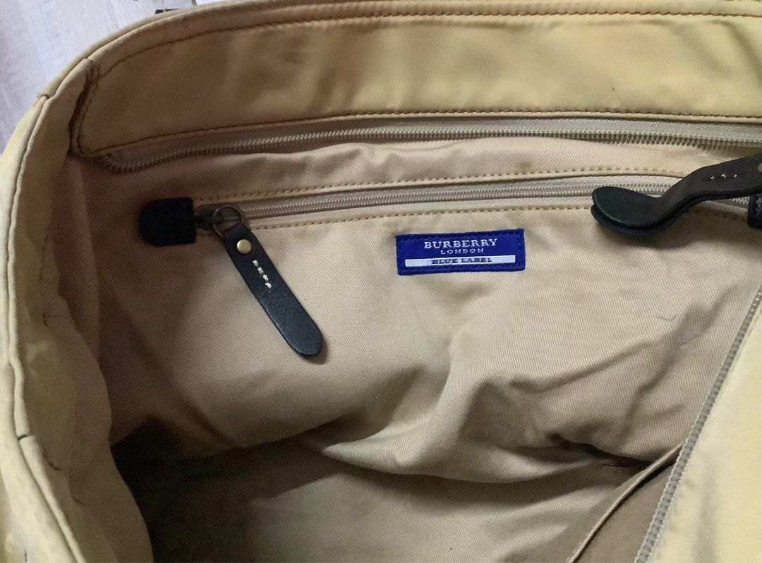 Burberry nylon blue label bag (Category: Luxury Bags & Wallets) located in Plaridel. Submitted by hiyas_ (Listing ID 1392573556, Image 3). Description: Burberry nylon blue label bag Issue: signs of usage, faded colors stains and bubbles sa nylon nya. Bukod dun wala naman napo Price: 800 shipped Malolos, Bulacan area..