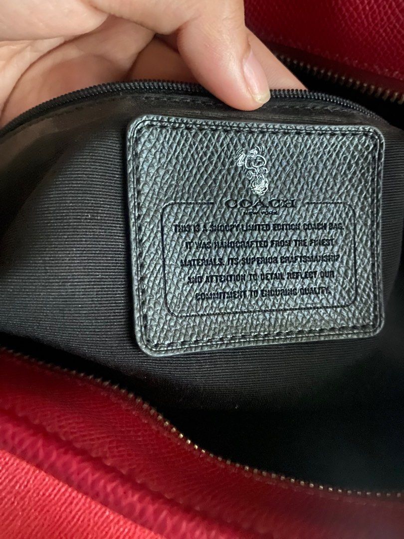 Coach Snoopy Red Tote Bag (Category: Luxury Bags & Wallets) located in Manila. Submitted by onangg (Listing ID 1392546861, Image 3). Description: 🎀bought from another seller (wants another bag huhuhuh) 🎀no issues on the inside (vv clean) 🎀 main issue: rubber linings on the handle as seen on the pic 🎀 w hang tag 🎀 og from japan pasabuy .