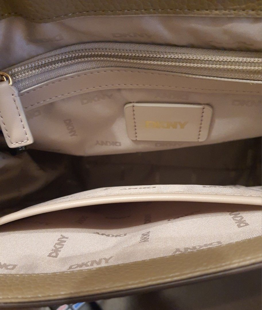 DKNY Backpack (Category: Luxury Bags & Wallets) located in Malolos. Submitted by aonf1 (Listing ID 1392491395, Image 3). Description: authentic DKNY convertible backpack thick removable straps and chains can be carried by hand, worn on shoulder, or as crossbody.